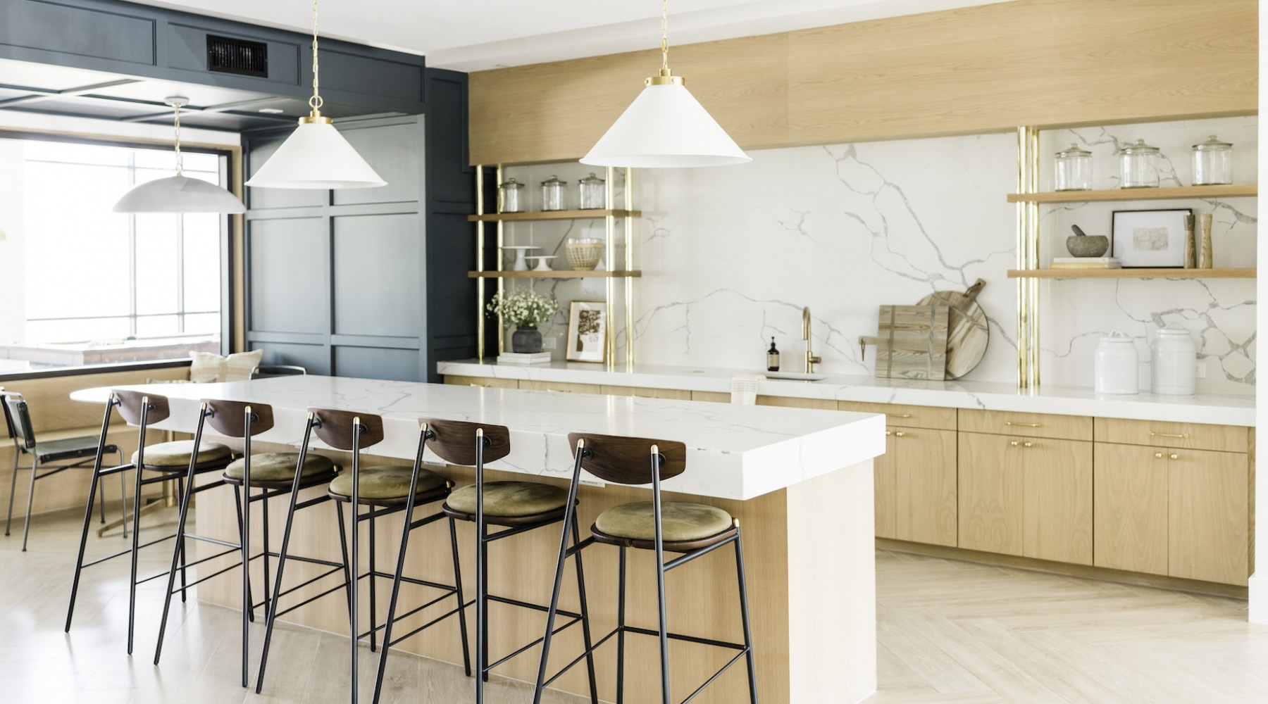 kitchen showing an island, bright lighting and modern appliances