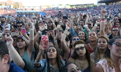 Friends and families enjoying outdoor summer events and activities in Frisco, TX.