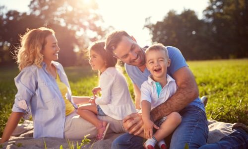 family with kids in a park